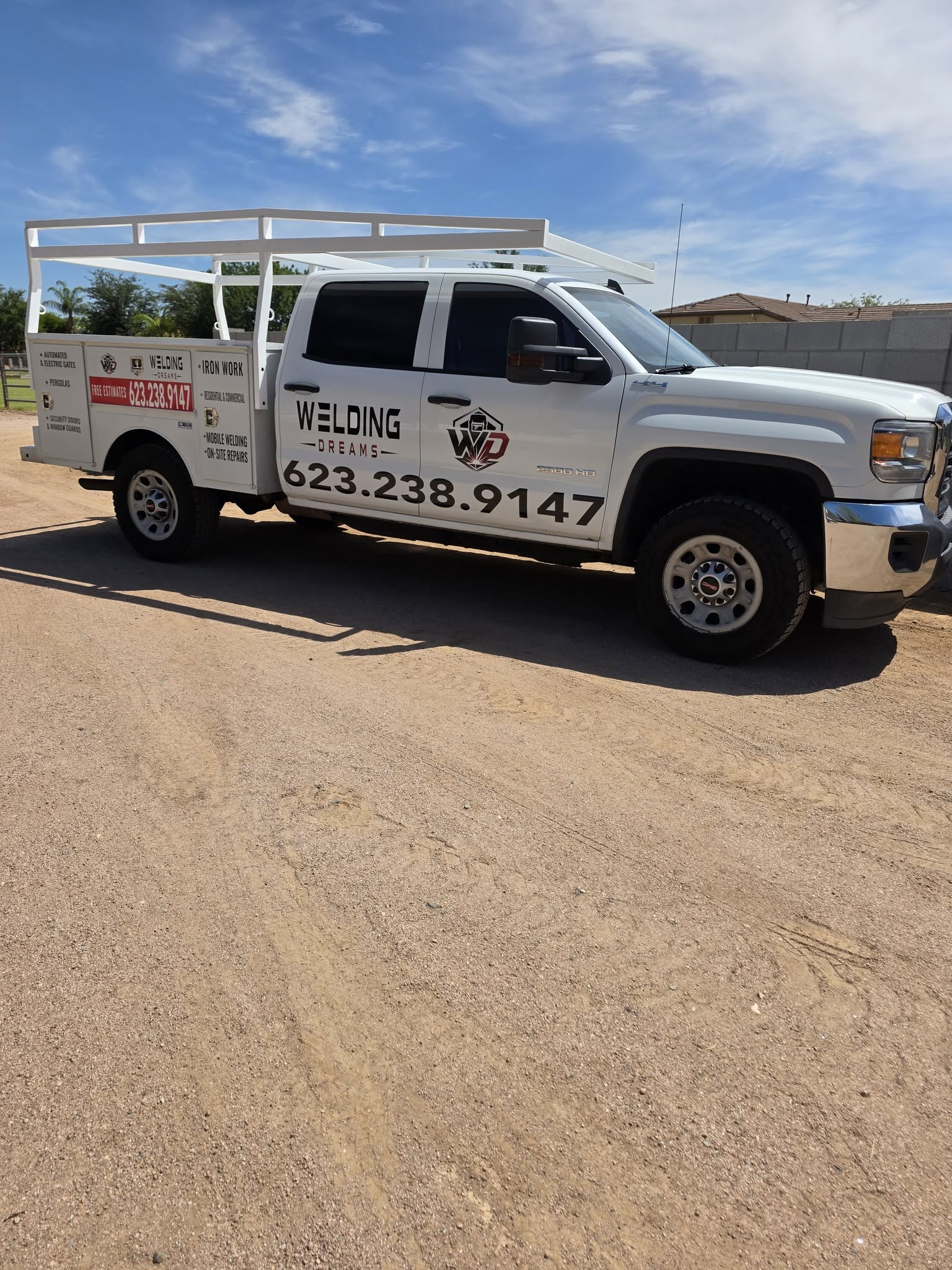 Welding Dreams work truck with the company logo and custom metal rack
